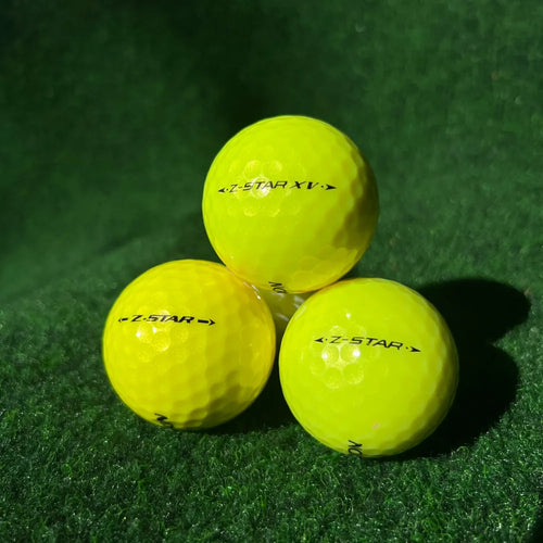 Srixon Z-Star ja Z-Star XV keltainen käytetty golfpallo nurmella